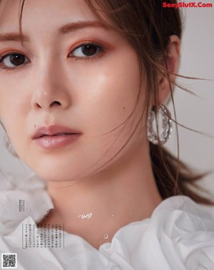A magazine with a picture of a woman's face.