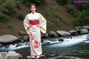 A woman in a colorful dress posing for a picture.