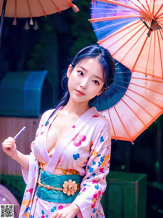 A woman in a kimono holding an umbrella.