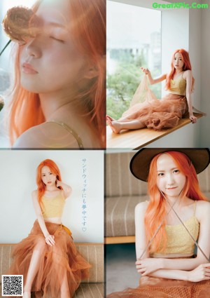 A woman with bright orange hair laying on a bed.
